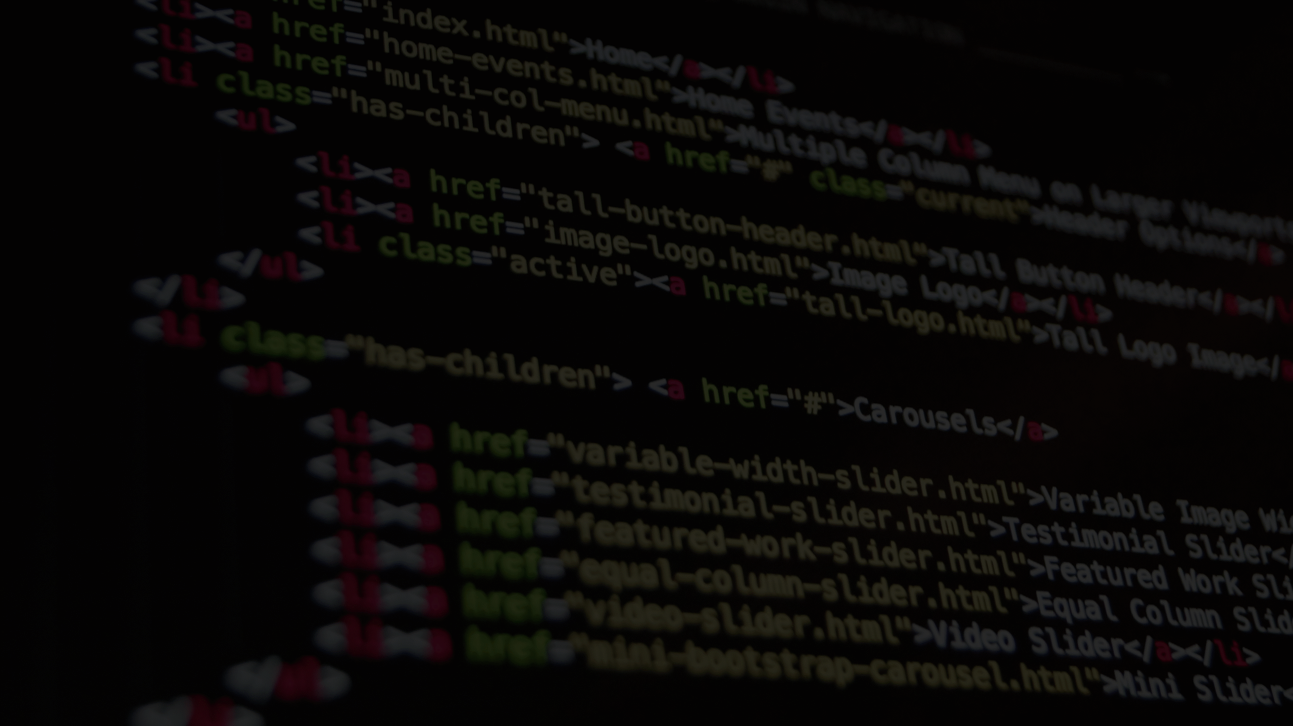 Close-up of HTML code on a dark screen, used as a background image for a wordpress developer's homepage hero section